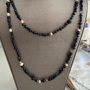 Very long beaded necklace